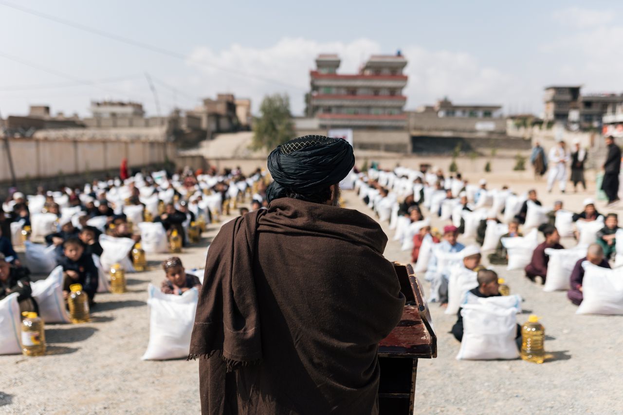 about-us Crowd gathered for a humanitarian aid distribution event in Afghanistan.